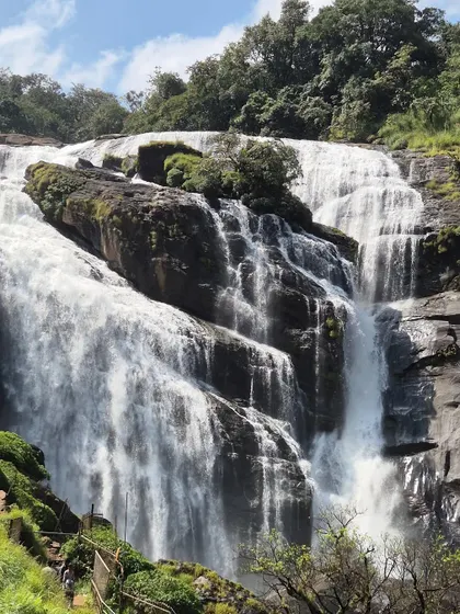 A powerful waterfall cascading down the rocks, seen on one of our monsoon treks. The raw beauty of nature is at its peak during this season.