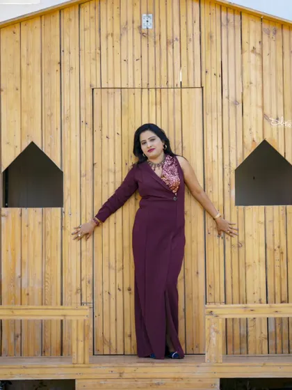 A fashionable shot in a rustic wooden cabin setting, perfect for a unique birthday photoshoot.