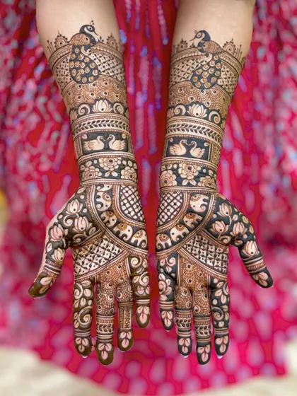 A straight-on view of this intricate design, showing the perfect symmetry and the rich application of the organic henna paste.