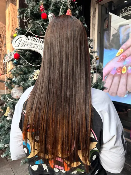Here is the final look from the back after a Hair Botox session. The hair is not just straight but also looks deeply conditioned and healthy, with a noticeable gloss.
