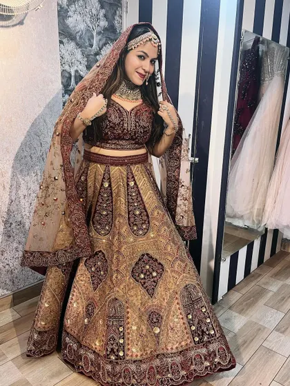 This photo shows how you can try the full look before you rent. The client is wearing a heavy bridal lehenga with a complete choker set, ensuring a perfect match for her wedding.