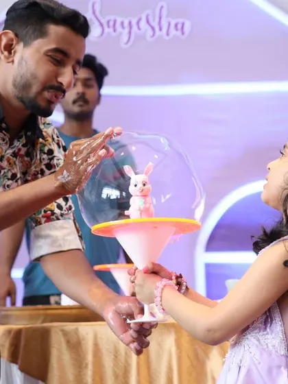 A bubble artist creates a magical moment by putting the birthday girl inside a giant bubble. It's a unique entertainment option that kids absolutely love.