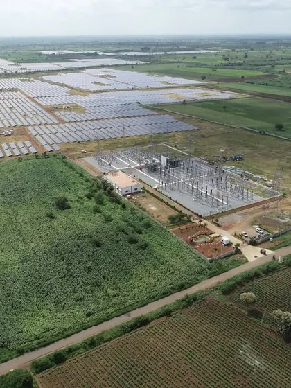 An aerial view showing the integration of our new 50.7 MWp solar project with the existing infrastructure at Gadag, Karnataka. This strategic expansion showcases our ability to scale operations efficiently while leveraging established grid connections.