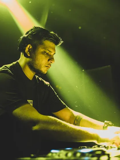 In the zone, focused on the mix. I use professional Pioneer DJ gear to ensure every transition is seamless and the sound quality is perfect for your event.