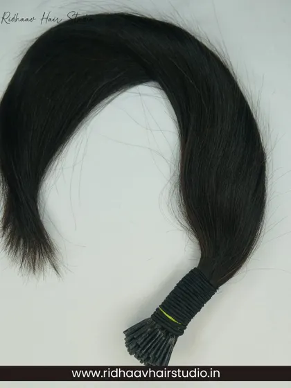 A bundle of our I-Tip Single Drawn Wavy Hair Extensions, showcasing their natural flow and high-quality human hair texture. Ideal for adding both length and gentle waves.