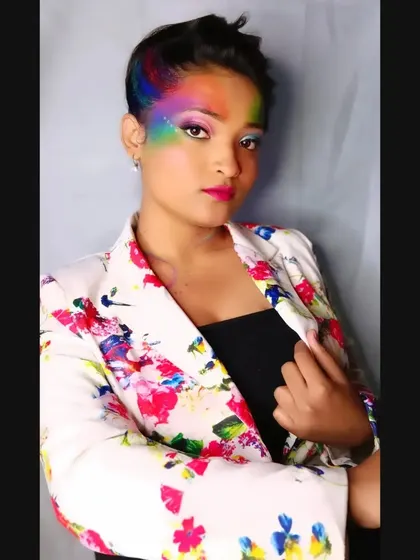 A direct portrait of the Holi-inspired look, showing the bold, blended colors and the confident attitude.