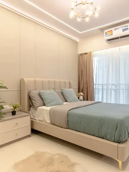 This serene bedroom is designed with our Urban Elegance theme. It features a neutral color palette, a comfortable upholstered bed, and large windows for plenty of natural light.
