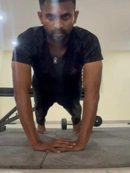 Another variation of a close-grip pushup, focusing on tricep engagement. The intensity of my gaze matches the intensity of the effort.