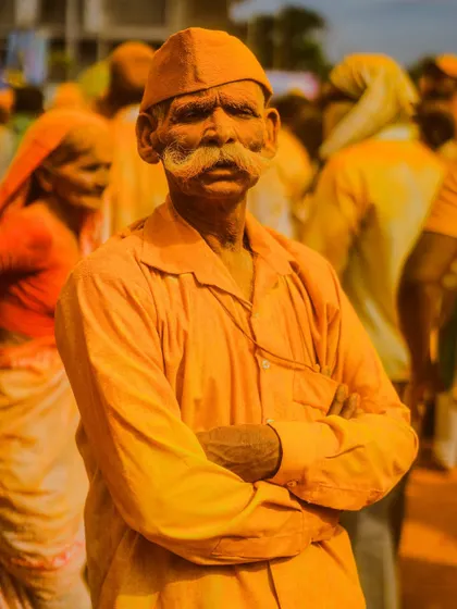 A series of striking portraits from the Pattan Kodoli festival. Each face tells a story, covered in the golden 'Bhandara' powder, reflecting deep faith and tradition.