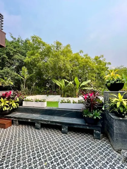 A terrace garden is not just for beautification, it's a necessity for reducing pollution. The plants supply fresh oxygen and absorb carbon dioxide, making the city a healthier place to live.