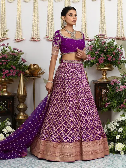 The same purple Banarasi lehenga with a short-sleeved blouse, showcasing its versatility.