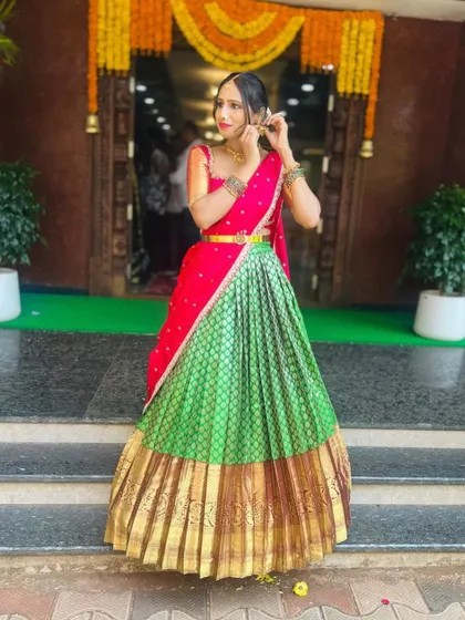 A festive shot of the red and green langa voni, perfect for temple functions or weddings.