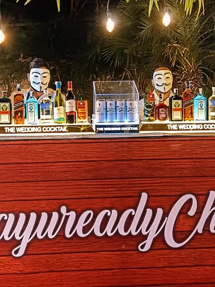 My bartenders can also be part of the theme. Here, they are wearing masks behind a custom-branded bar, ready to serve a wide selection of drinks.