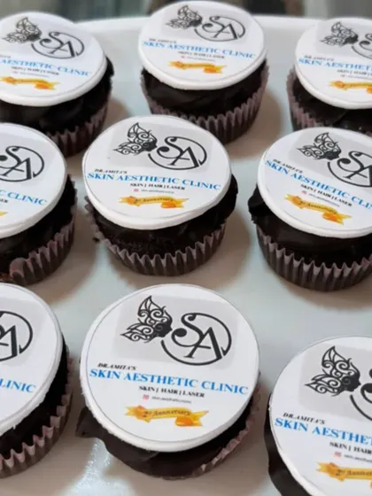 Branded cupcakes are a great way to share a sweet treat at company events. Here, I've topped chocolate cupcakes with crisp, edible discs featuring the logo for a skin aesthetic clinic, ensuring perfect brand representation in every bite.