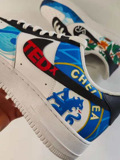 This pair was a mashup of all the client's favourite things, including his love for Chelsea FC. I painted the club's shield right over the Nike swoosh.