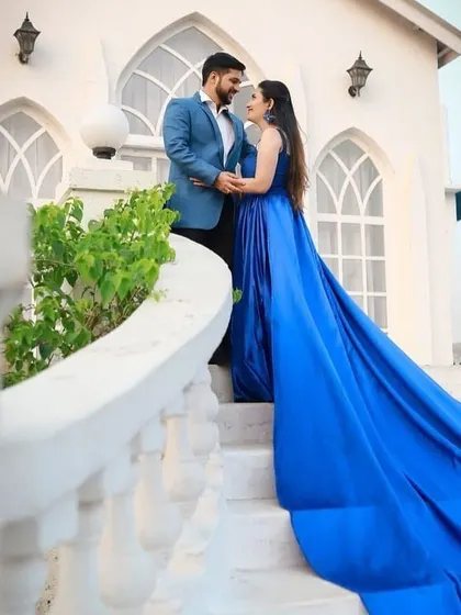 A royal blue gown that makes a powerful statement. The rich color and voluminous trail ensure you stand out and create unforgettable pre-wedding memories.