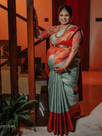 A full-length shot of the mother-to-be, her hands lovingly cradling her baby bump, a picture of pure joy and anticipation.