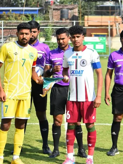 A pre-match lineup featuring our player as captain in the Reliance Development League, competing against top clubs like Mohun Bagan.