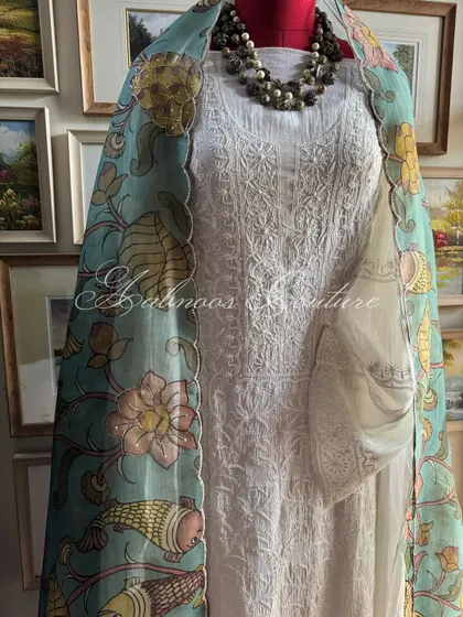 A full-length styled view on a mannequin, demonstrating how the dupatta can be draped to create a graceful and sophisticated silhouette.