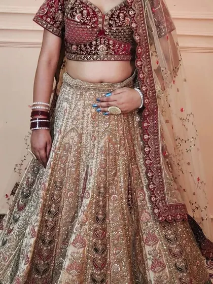 A closer look at the handwork on the Marwari bridal lehenga skirt. The intricate patterns and colours are a testament to traditional craftsmanship.