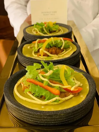 Our inventive Butter Chicken Tacos, another example of our playful and delicious approach to modern Indian fusion cuisine.