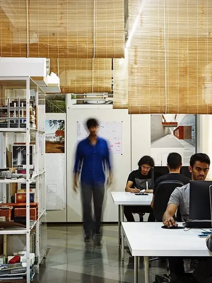 Another view of my design studio, showing the team at work. The open layout, natural light, and organized storage create an efficient and pleasant environment for the intense, detailed work of architecture.