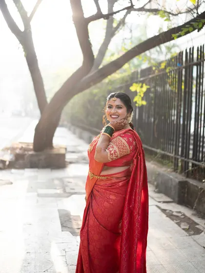 A side profile of the bride, capturing her grace and the elegance of her attire.