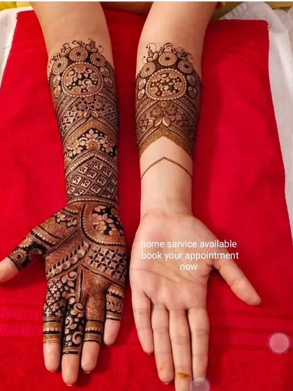 A half-and-half design showing the intricate mehndi on one hand and the clean palm on the other. This is a great way to see the detail before committing to both hands.