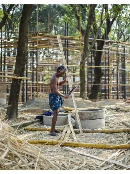 A craftsman at work during the construction of the Koodaaram Pavilion. The project celebrated local materials and building techniques, particularly the use of bamboo.