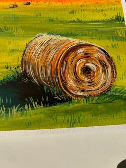 A detailed shot of the rolled haystack from my landscape painting. I used fine brushstrokes to give it a realistic, textured look.