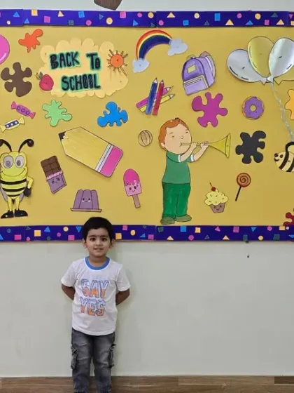 This little one is ready for his first day of school, standing proudly in our decorated classroom.