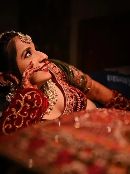 A candid and dreamy bridal portrait, capturing a moment of happy contemplation before the ceremony.