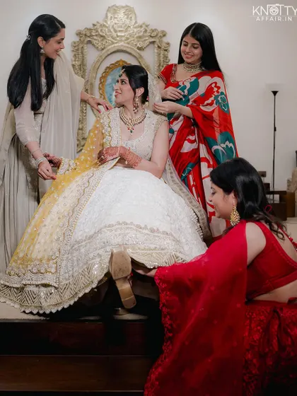 The bride getting ready with her bridesmaids, a moment of friendship and support before the ceremony.
