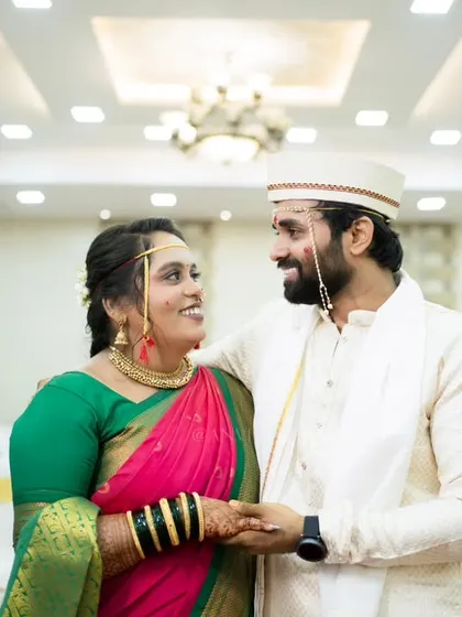 A beautiful portrait in a grand hall, capturing a look of love and admiration between the couple.