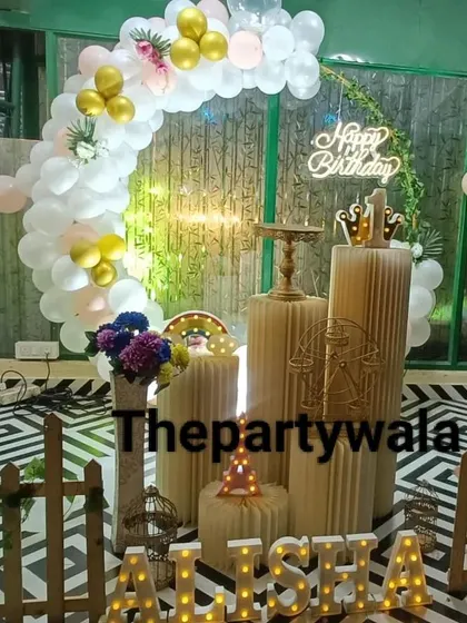 A simple and elegant ring decoration with white and gold balloons.