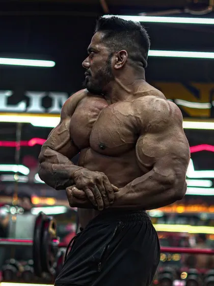 2025 is your mature year. Control your mouth, mind, mood, and money. A powerful side chest pose.