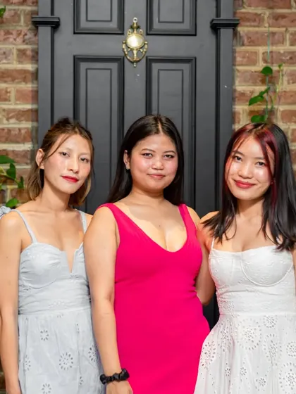 A trio of ladies looking elegant and ready for a fun night.