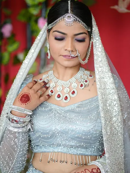 This image shows the intricate details of the makeup with the eyes closed, a great example of the cut-crease technique we cover in the advanced module.