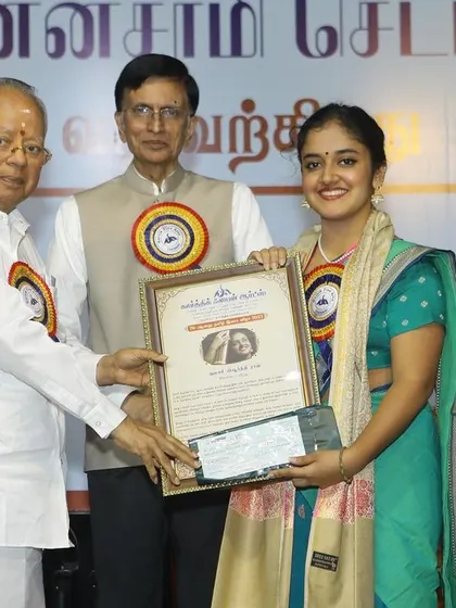 Holding the 'ISAI CHUDAR' award certificate from Kartik Fine Arts. I am always grateful to the sabha committees for selecting me for these honors.