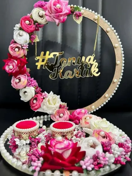 Another design for a custom engagement ring platter, featuring a large floral hoop with a personalized hashtag and two ring holders.