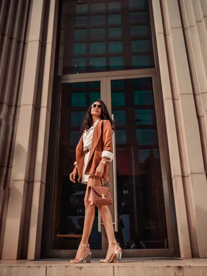 Posed against a grand entrance, ready for the next big opportunity. This is the final shot from a series that defines my boss-lady style.