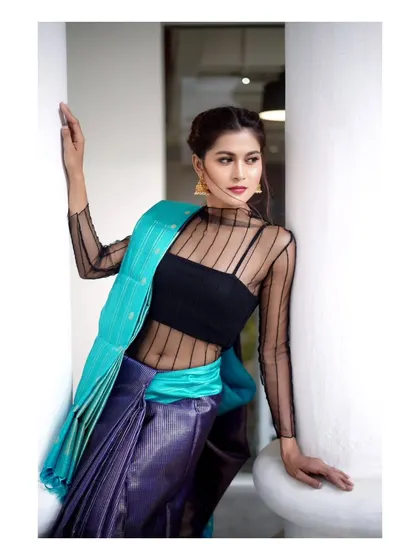 Another look from our modern Kanchipuram saree shoot. This pose highlights the beautiful fabric and the model's elegant posture.