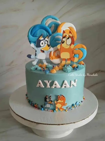 A cute cake I made for Ayaan featuring his favorite characters from the show Bluey. The bright colors and playful design made it a big hit at his party.