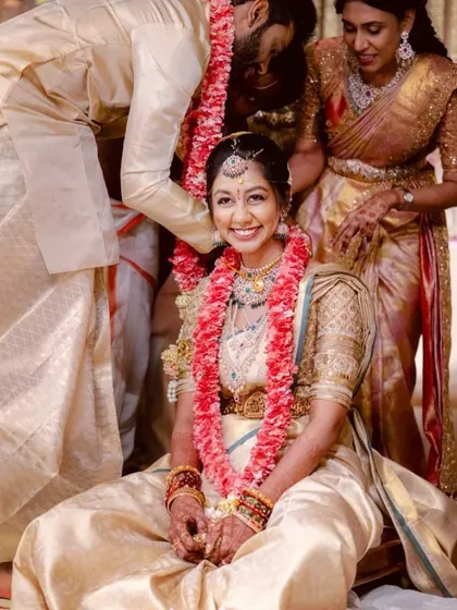 Pure joy. My bride looks so happy and comfortable in her custom-fit golden wedding blouse during her ceremony.