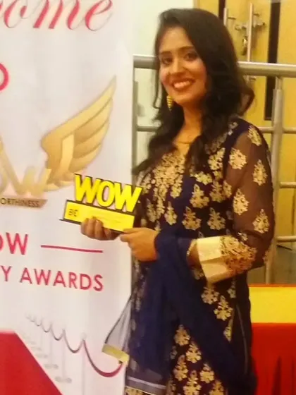 Holding the "WOW Personality" award from 2016. This was a key moment that propelled my journey of excellence in the field of Tarot.