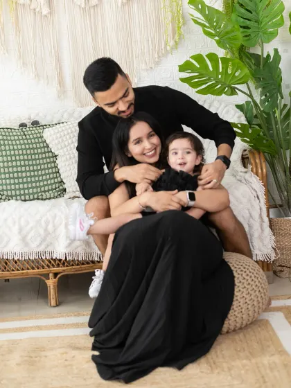A cozy and candid family hug on our boho set. These moments of closeness and affection are what family photography is all about.