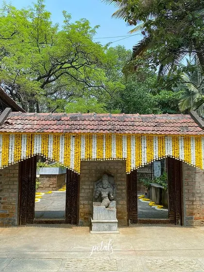 A duplicate image of the entrance, showcasing the beautiful architecture and floral decor.