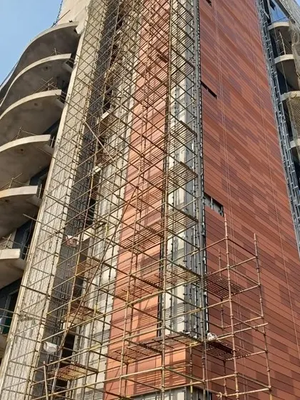 The facade of Peerless Hospital in Kolkata nearing completion. This image shows the terracotta cladding and undulating balconies taking shape, translating the architectural vision from drawing board to reality.