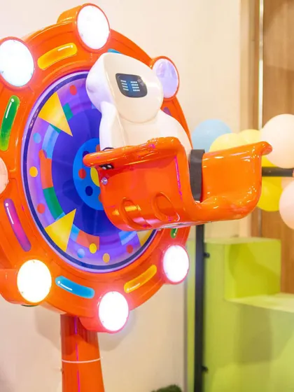 This spinning ferris wheel ride is a colorful and exciting attraction in our arcade zone.