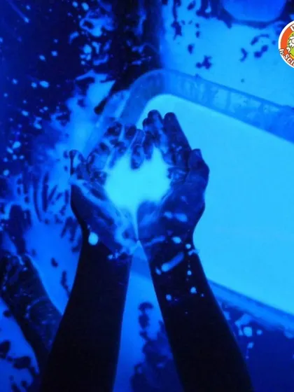 The beauty of phosphorescence. This image captures the magical blue glow of one of our hands-on science experiments, perfect for a Halloween or space-themed event.